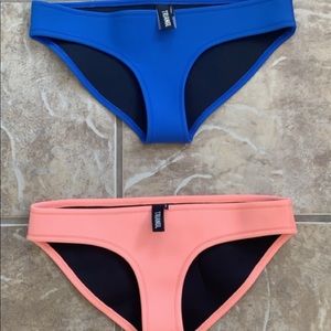 Two Triangl bottoms, dark blue and coral colored